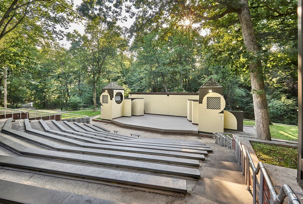 A large outdoor amphitheater with tiered seating and a stage.