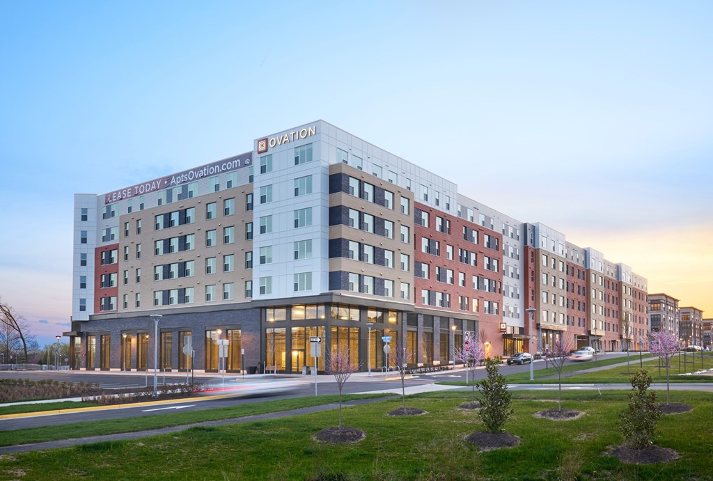 A large hotel building with the name Ovation on it.