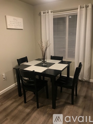 A black and white checkered table with four chairs.