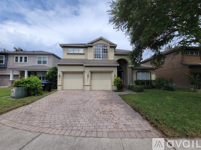 A house with a driveway in front of it is for sale.