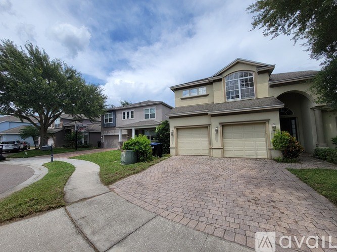 A house with a driveway in front of it.