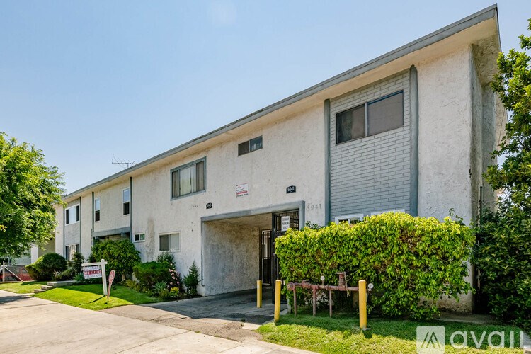 A building with a sign that says "available" in front of it.