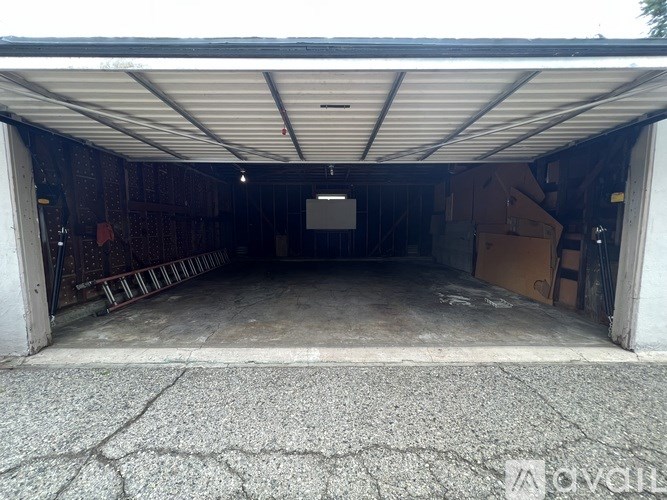 A large garage with a concrete floor and a white ceiling.