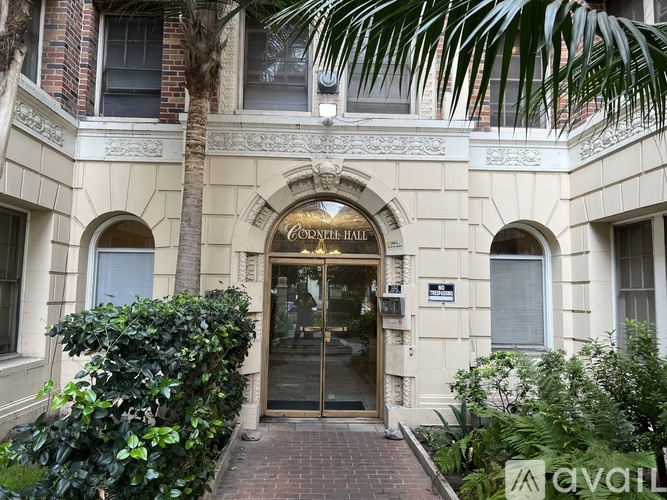 The entrance to a building with a sign that reads "Golden Hall".