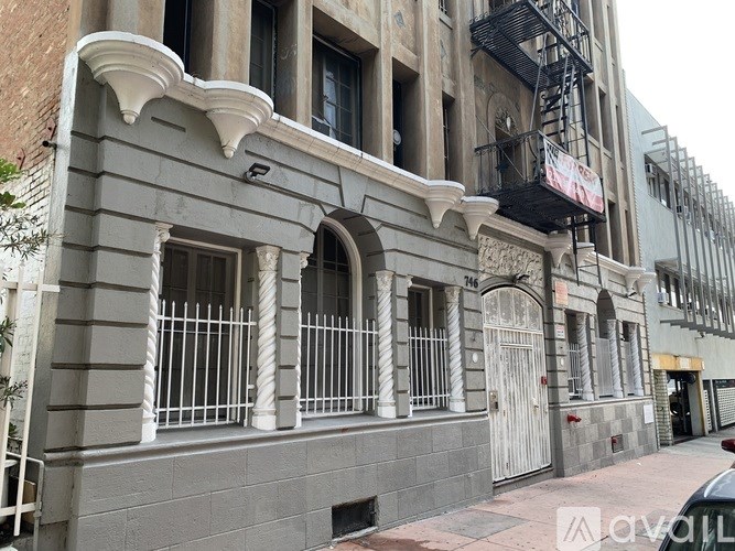 A building with a balcony and a fire escape.