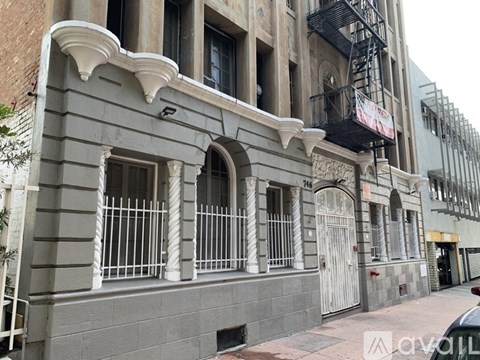 A building with a balcony and a fire escape.