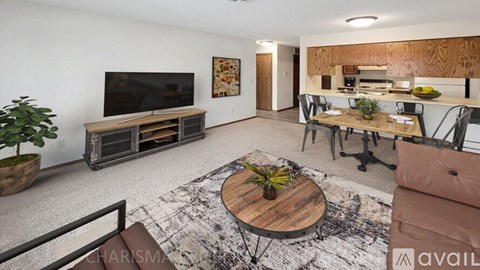 A living room with a wooden coffee table in the center.