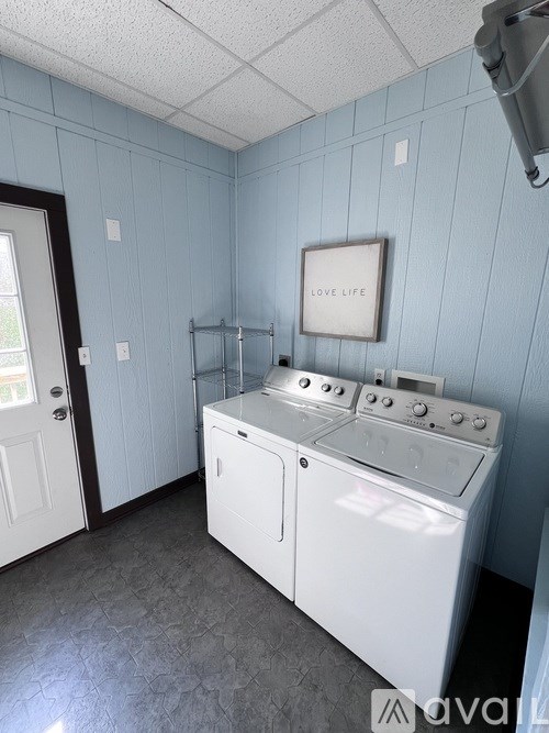 A laundry room with a washer and dryer.