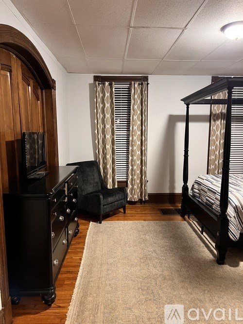 A laundry room with a washer and dryer and a sign that says "Love Life".