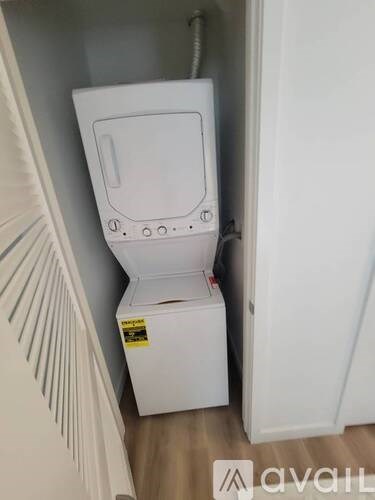 A white box with a yellow sticker on it is in a corner.