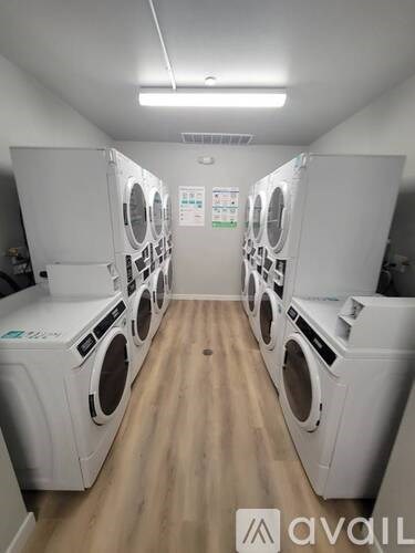 A row of washing machines in a laundromat.
