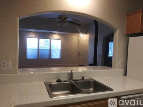A kitchen with a sink and a window.