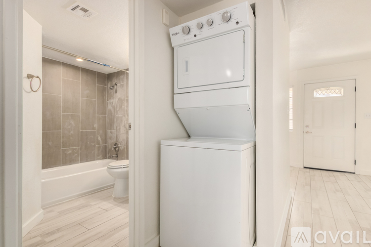 A white oven and dishwasher in a kitchen.