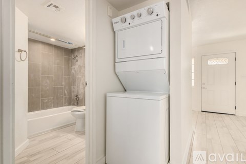 A white oven and dishwasher in a kitchen.