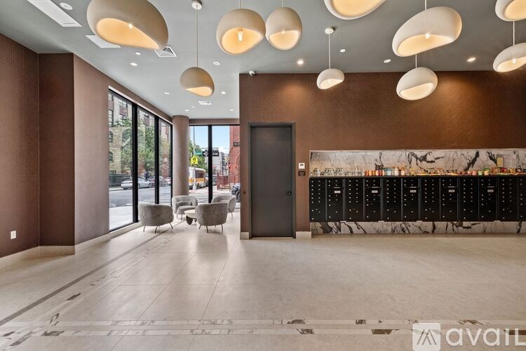 A modern interior space with a bar and seating area.