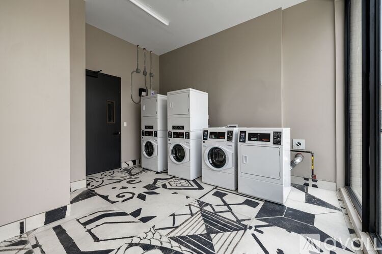 A laundry room with a washer and dryer in it.