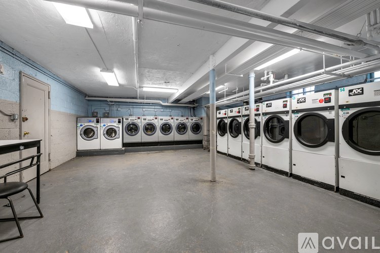 A row of washing machines in a laundromat.