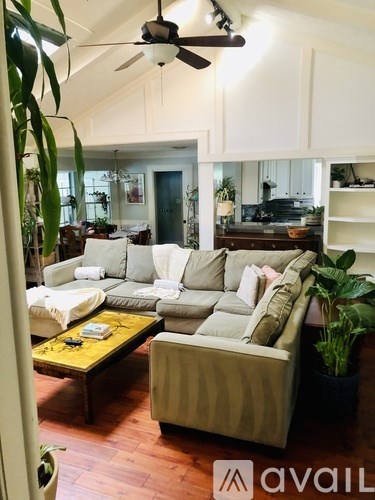 A living room with a sofa and a coffee table.