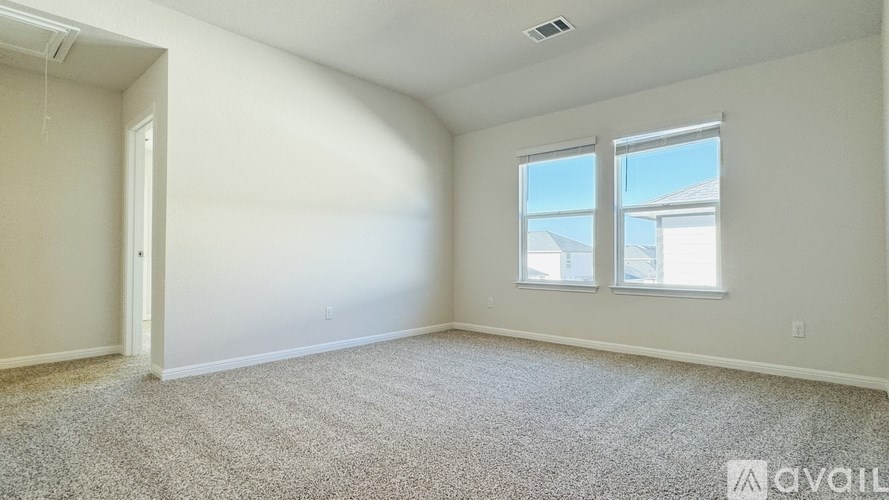 A bathroom with a sink, mirror, and light switch.