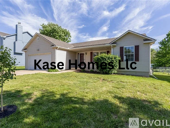 A house with the text "Kase Homes Ltc" on the front yard.