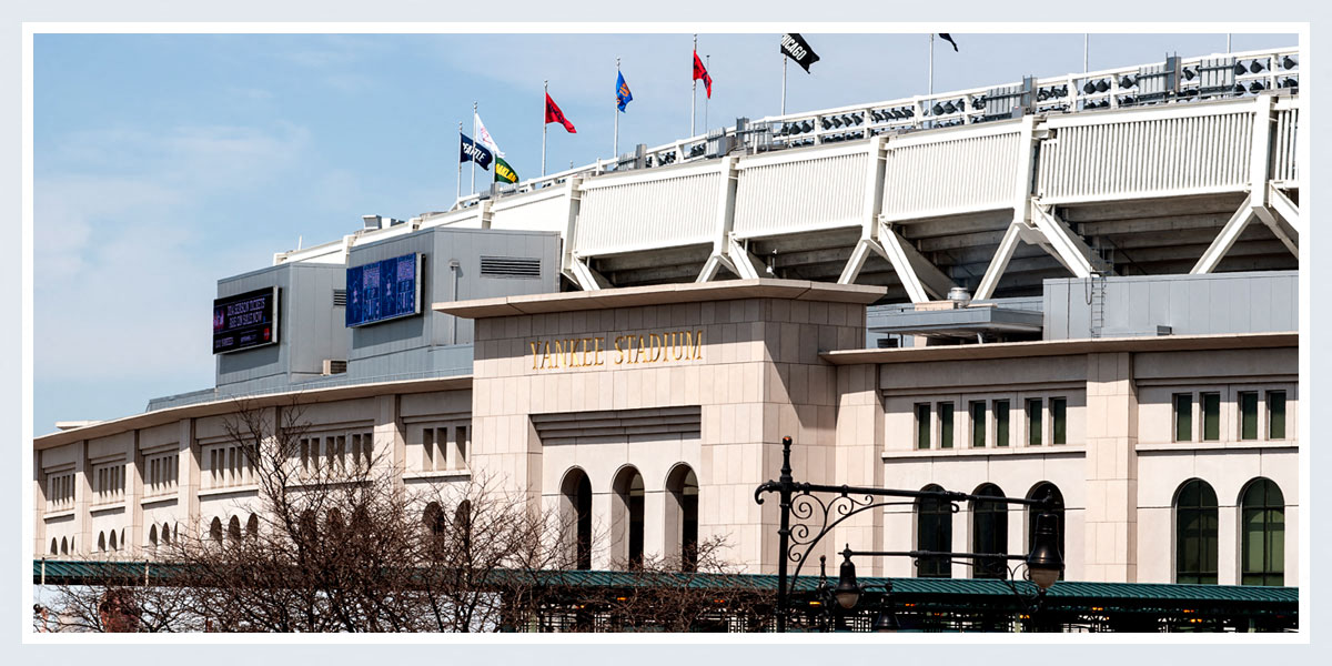 the side of a building with flags on top of it