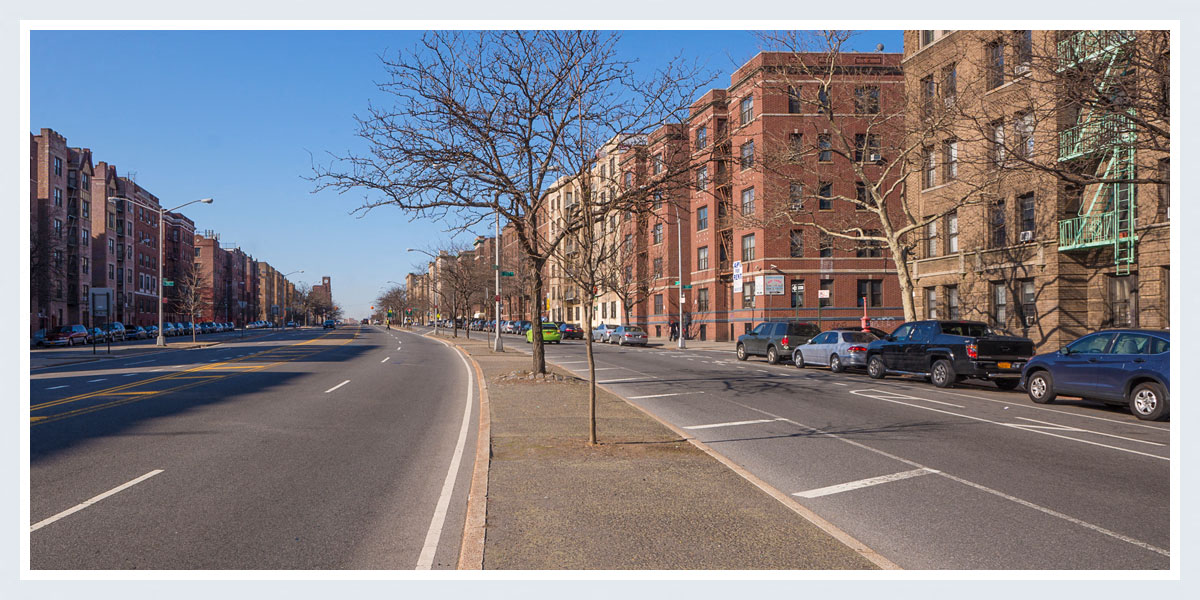 a city street with cars parked on the side of it