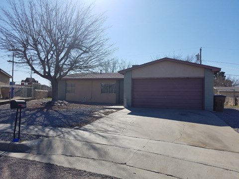 A house with a driveway and a mailbox.