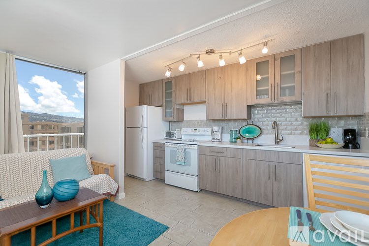 A kitchen with a dining table and chairs.