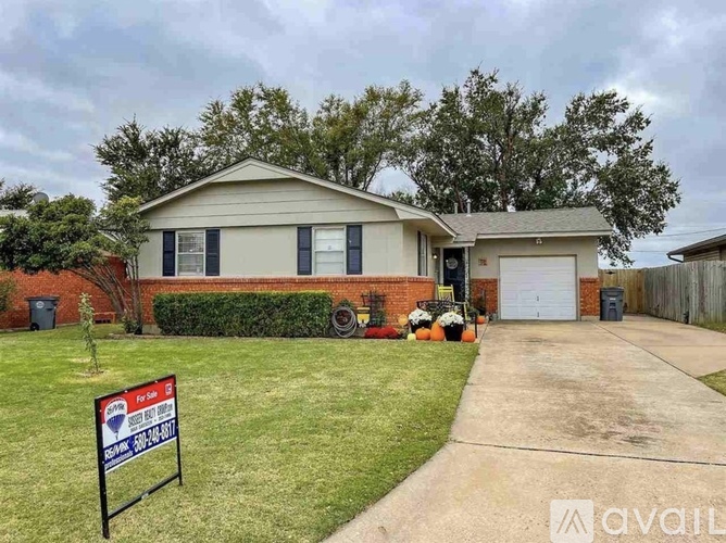 A house with a yard is for sale.