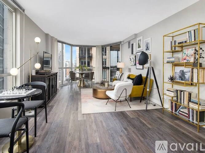 A living room with a chessboard and a bookshelf.