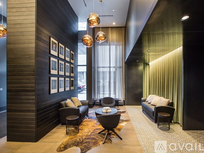 A modern living room with a black and white color scheme.