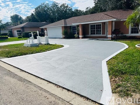 A house with a driveway in front of it.