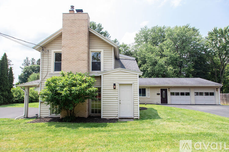 A house with a white garage door is for sale.