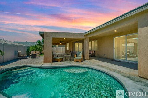 A modern house with a swimming pool in the backyard.