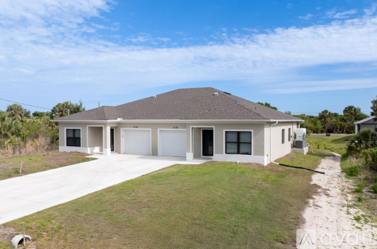 A house is available for sale in a field.