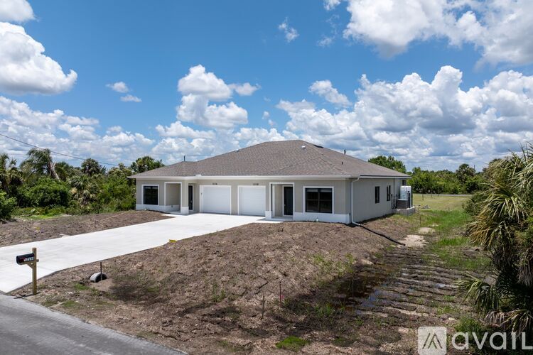 A house with a truck parked in front is for sale.