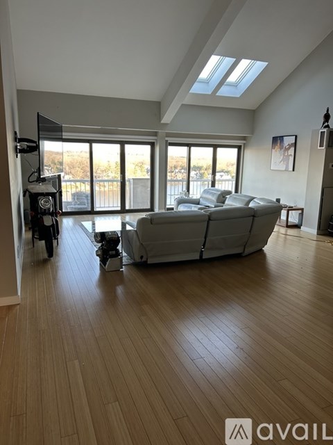A living room with a couch and a television.