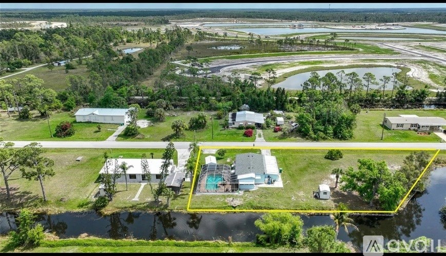 A bird's eye view of a property with a swimming pool and a yellow square highlighting a specific area.