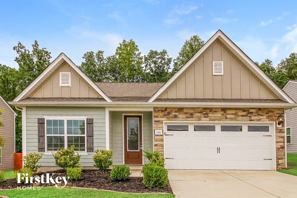 A house with a brown garage door and a brown window.