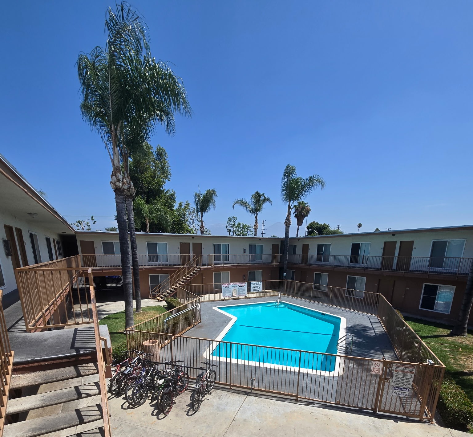 A pool surrounded by buildings.