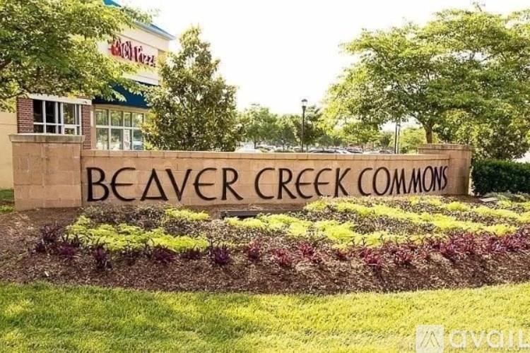 A sign that says Beaver Creek Common in front of a building.