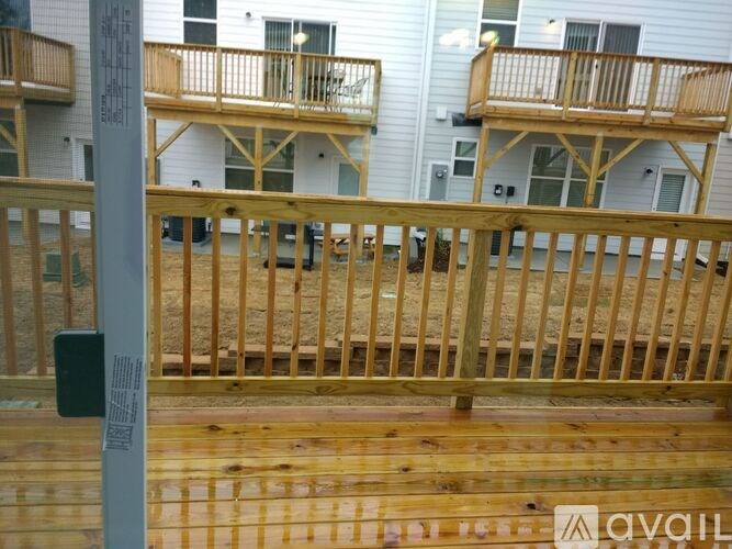 A wooden deck is being constructed in front of a building.