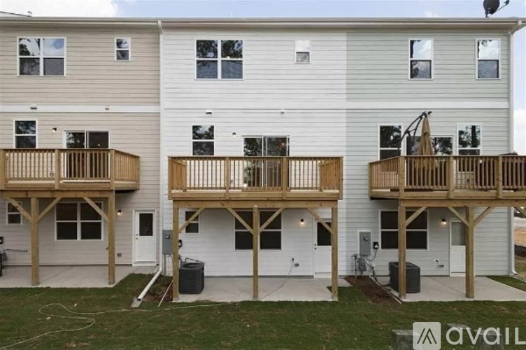 A two-story apartment building with balconies on the second floor.