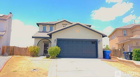 A house with a garage is for sale.