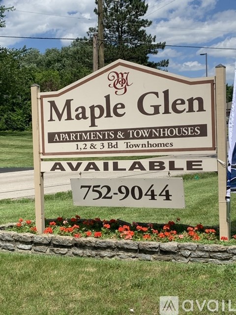 A sign for Maple Glen apartments and townhouses with a phone number for availability.