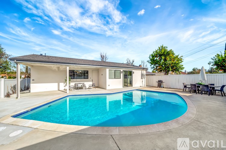A house with a swimming pool in the backyard.