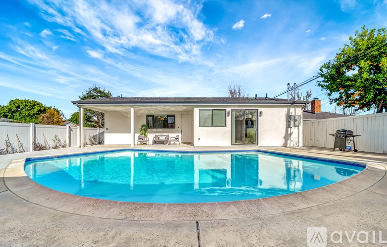 A house with a pool in the backyard.