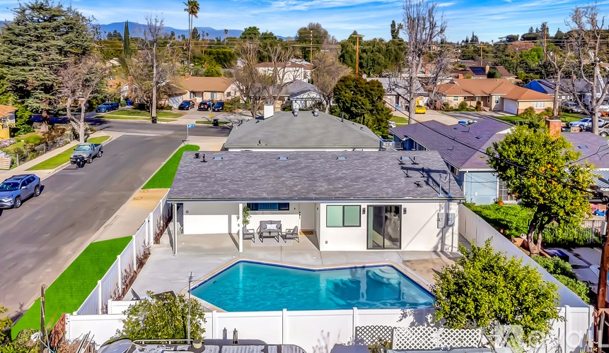 A house with a pool in the backyard.