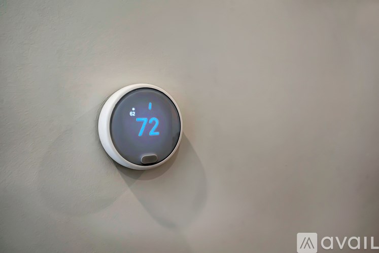 A digital thermostat displays a temperature of 72 degrees.
