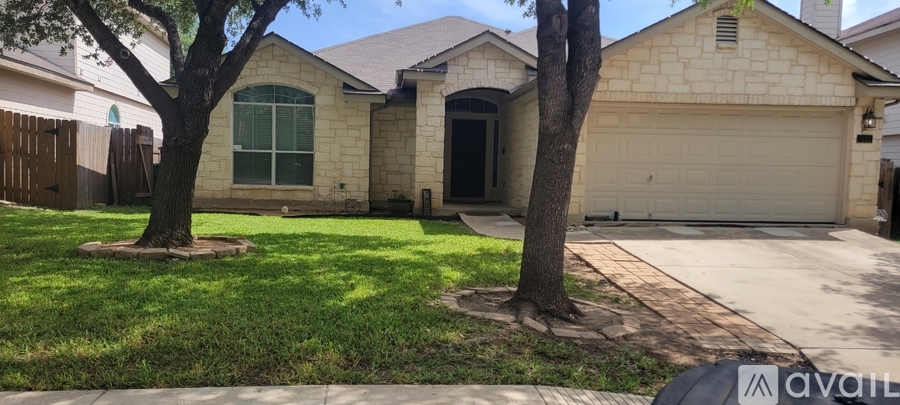 A house with a driveway in front of it.